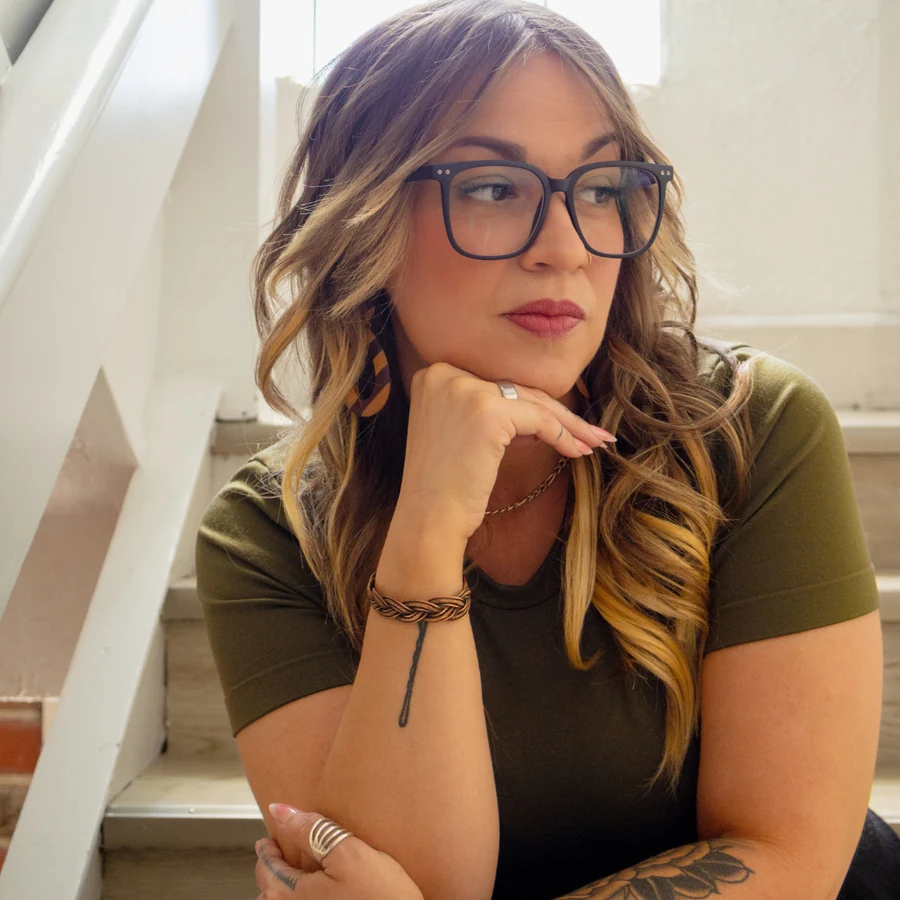 Danielle Penz seated beside a window